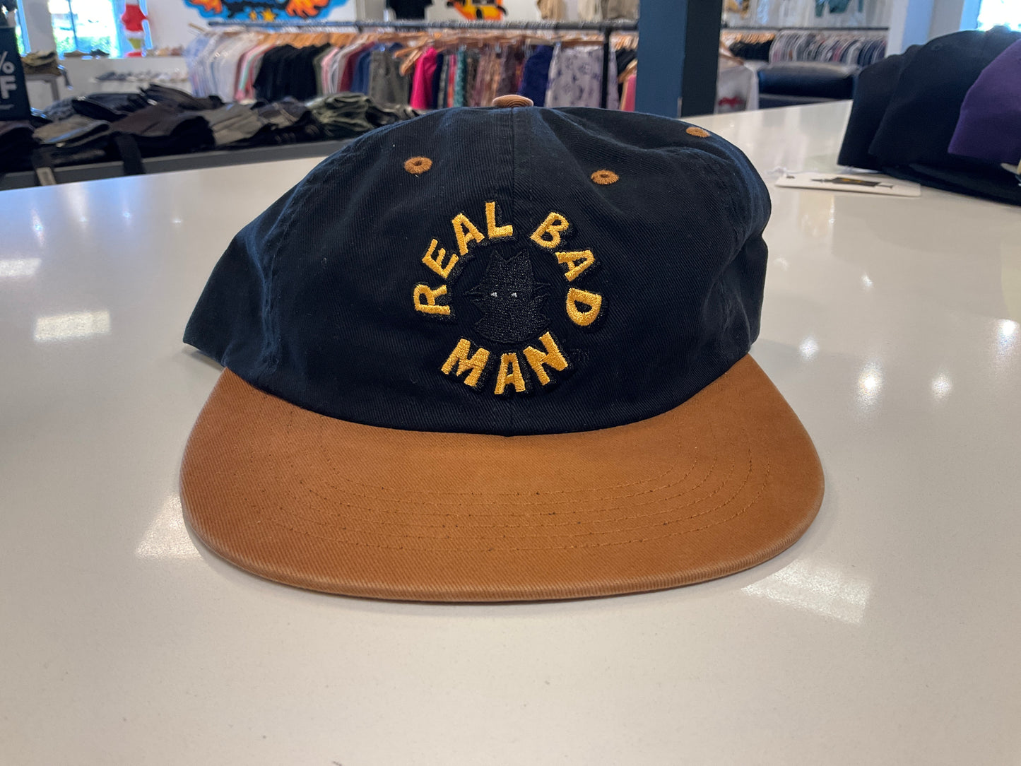 Real Bad Man Circular logo SnapBack Hat Navy/Bronze