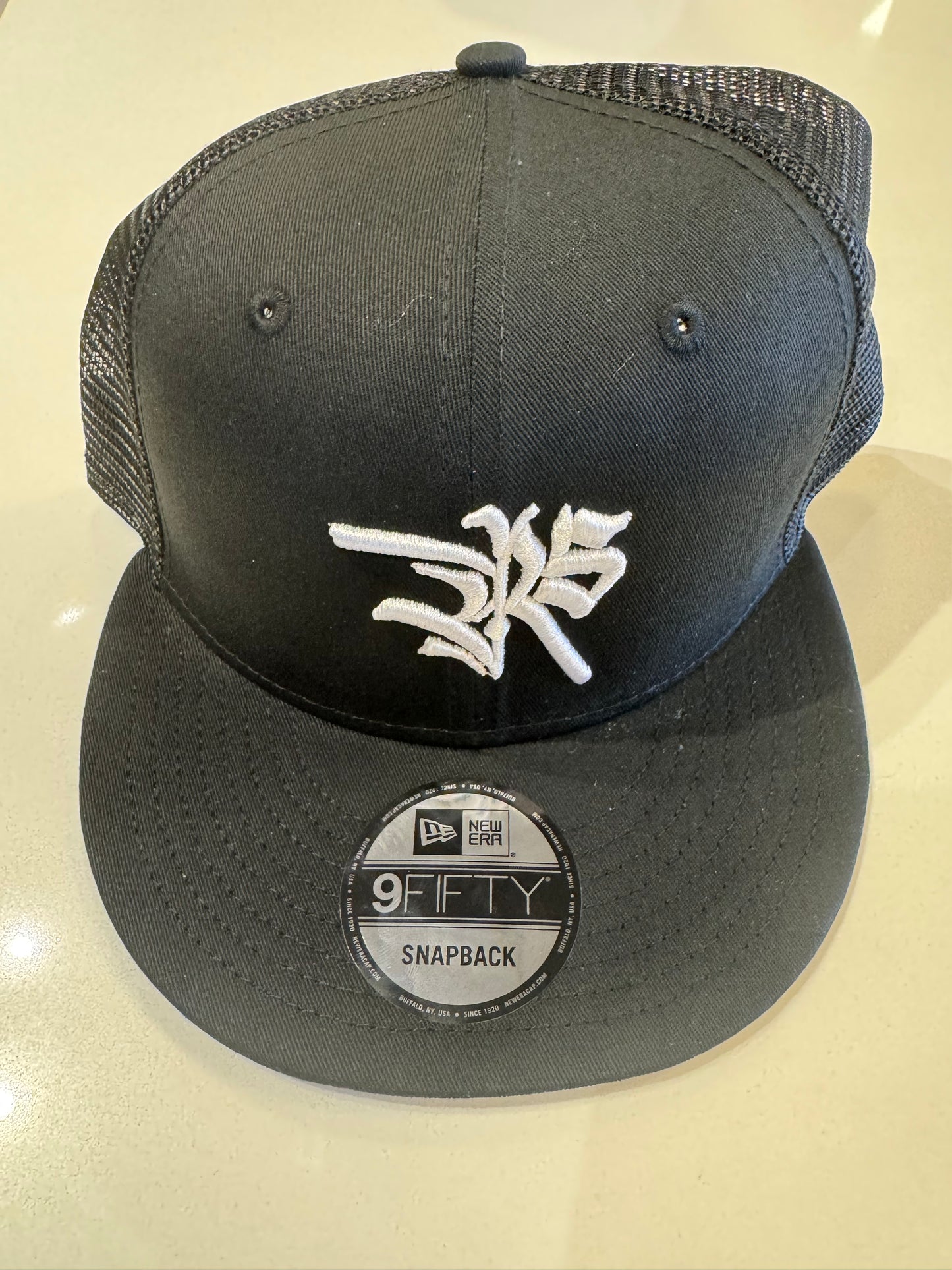 Revive Studio Black SnapBack Trucker